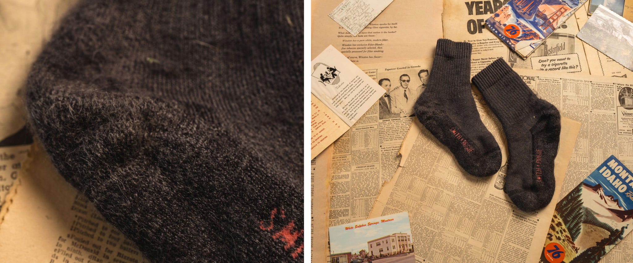 Grey Socks with orange lettering laying on newspaper and maps
