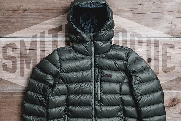 777 Front Range Jacket on a wooden background with Smith & Rogue Logo behind