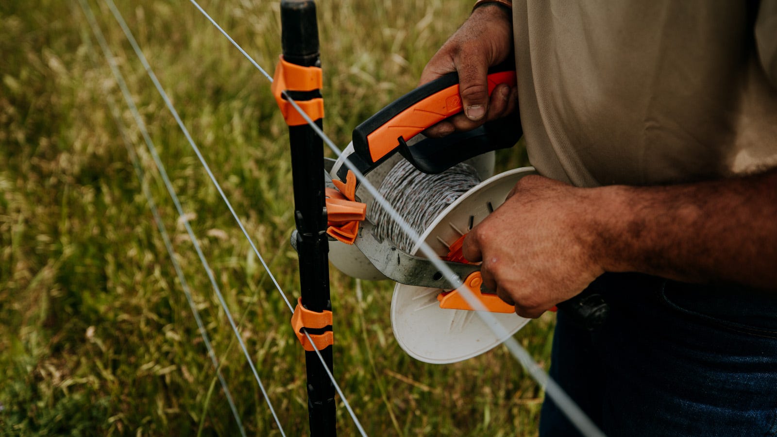 Gallagher turbo wire being installed on a post