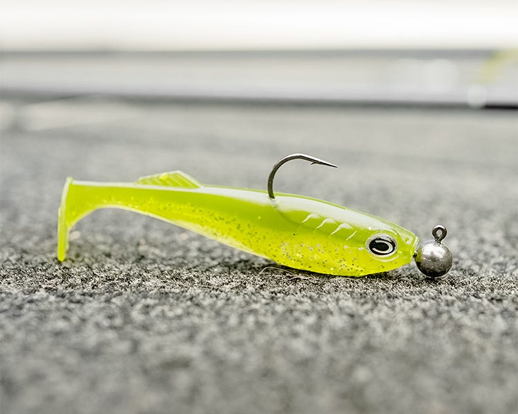 Cast fishing co Prodigy swimbait chartreuse color on a jig head 