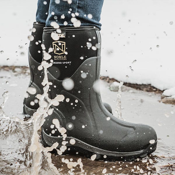 Noble MUDS mid boots splashing in water. Click to shop men's mid MUDS boots