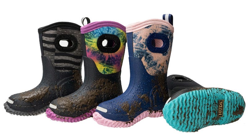A selection of four Noble MUDS kids boots with mud on the them