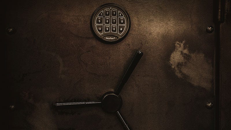 A weathered metal safe with digital keypad