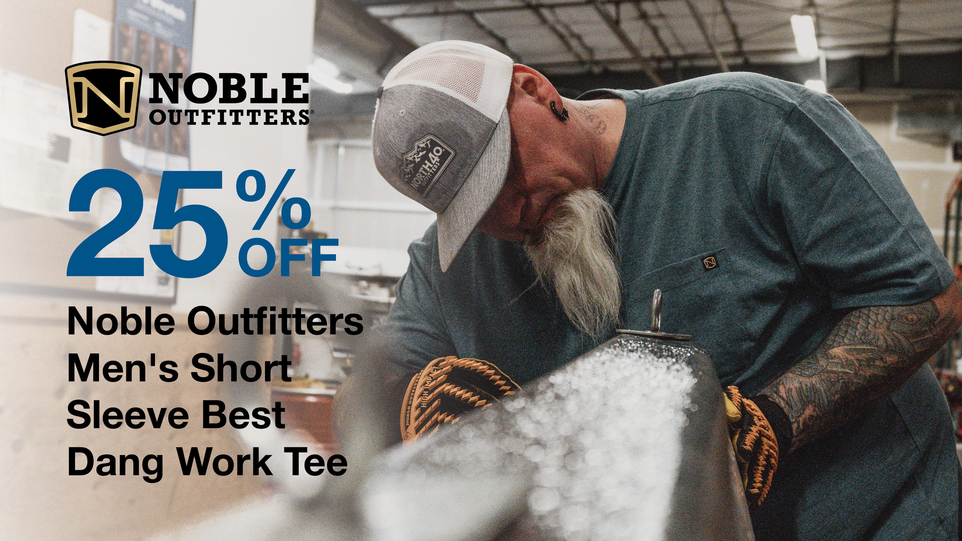 Text reads "25% Off Noble Outfitters Men's Short Sleeve Best Dang Work Tee" Background of a man working on a car wearing a blue Noble Outfitters Best Dang Work Tee