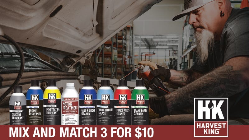 Advertisement for Harvest King automotive products with nine cans displayed. Man works on a car engine in a garage. Text: 'Mix and Match 3 for $10.' Harvest King logo on the right. The setting conveys a practical, hands-on vibe.