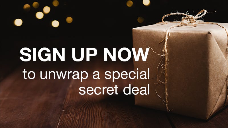 sign up now to unwrap a special secret deal. gift wrapped in front of tree.