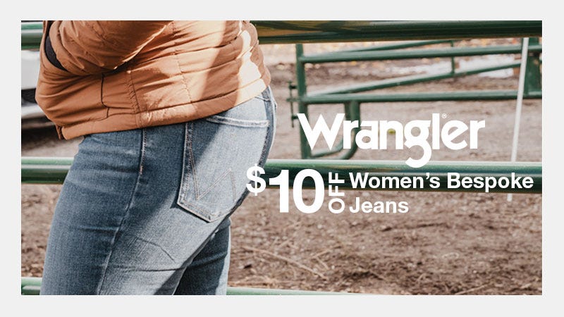 Close mid shot of woman leaning on her side with focus on Wrangler pocket. Text reads to her right "Wrangler: $10 OFF Women's Bespoke Jeans"
