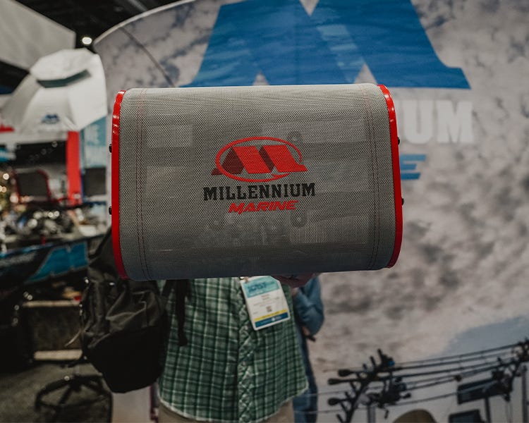 millenium palma horse boat seat being held up at the icast 2026 booth