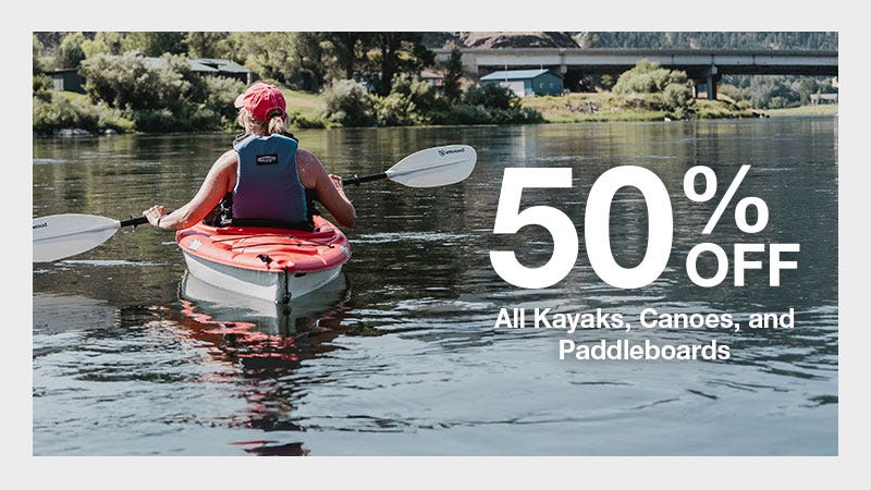 A woman kayaking on water with a promotional banner reading 50% off all kayaks, canoes, and paddleboards.