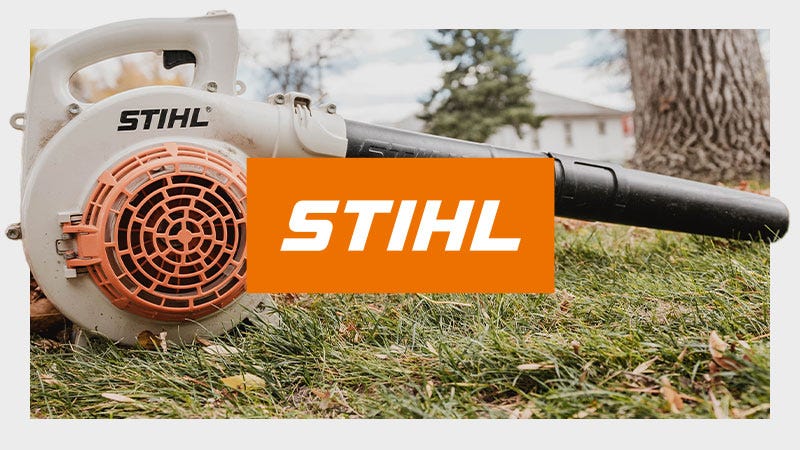 A STIHL leaf blower resting on grass with a prominent STIHL logo displayed in the center of the image.