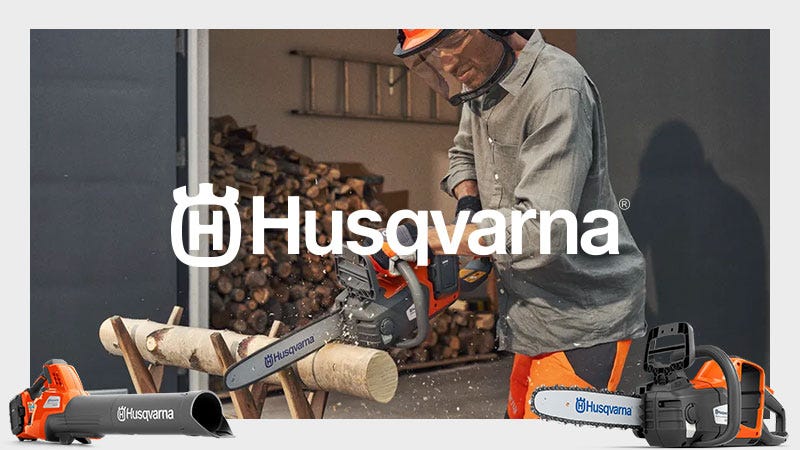 Husqvarna Chainsaw being used on a tree with a orange Husqvarna Logo