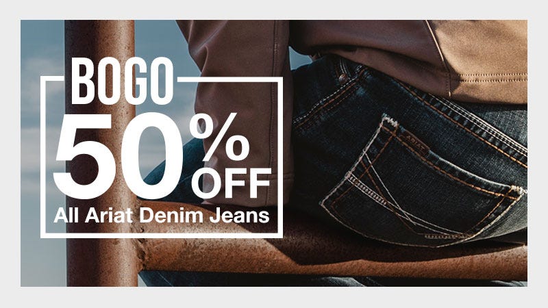 Image of man sitting on fence with extreme close up of "Ariat" logo on jeans. Text to the left of subject reads "BOGO 50% OFF: All Ariat Denim Jeans"