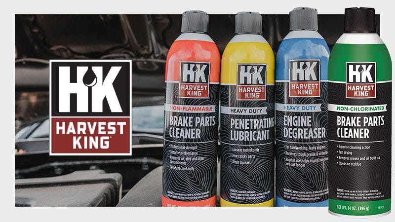 4 Harvest king chemical products on top of open car hood. 