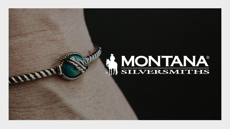 A close-up of a wrist wearing a twisted silver bracelet with a turquoise stone, next to the Montana Silversmiths logo featuring a cowboy on horseback and bold white text.