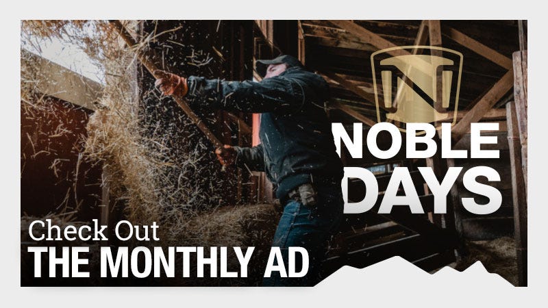 A person is using a pitchfork to move hay inside a barn, with sunlight streaming in. The text on the image reads "Noble Days" and "Check Out The Monthly Ad."