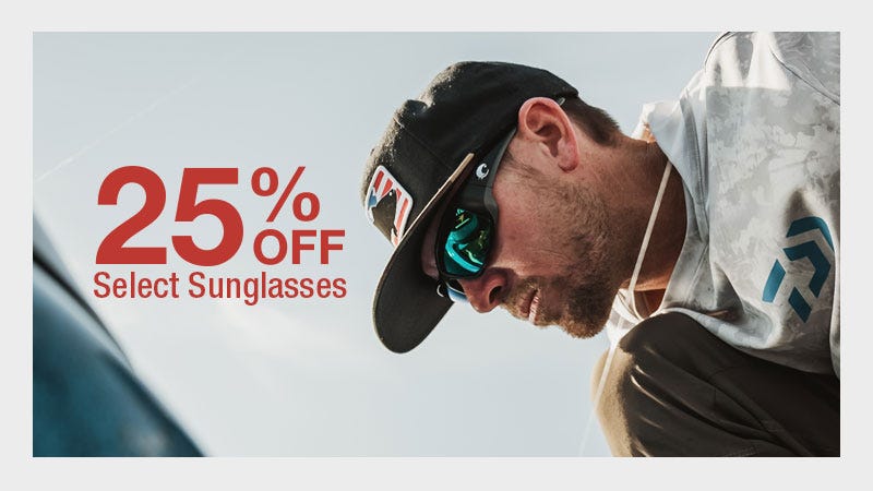 Close up shot of man looking down tying a fishing line, camera focused on sunglasses. Text reads "25% Off Select Sunglasses"
