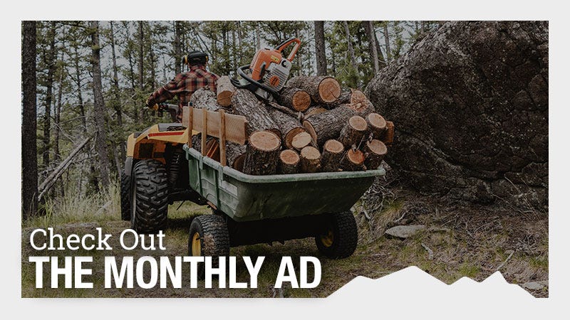 A person driving an ATV is pulling a trailer filled with cut logs and a chainsaw in a forested area. Text on the image reads "Check Out THE MONTHLY AD."