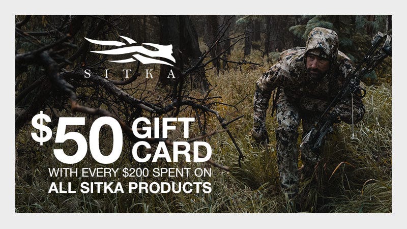 Man hunched down in camo creeping towards camera; looking off to the distance towards the left. Text reads in negative space "$50 Gift Card: WIth Every $200 Spent on All Sitka Products."