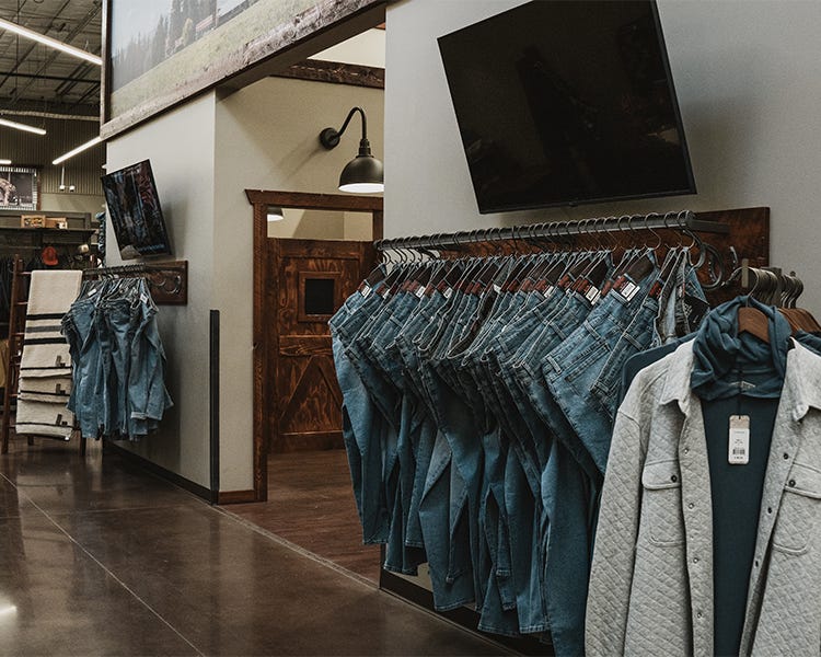 Clothing department fitting rooms at the Trent Spokane North 40 Outfitters with Smith and Rogue Jeans on display