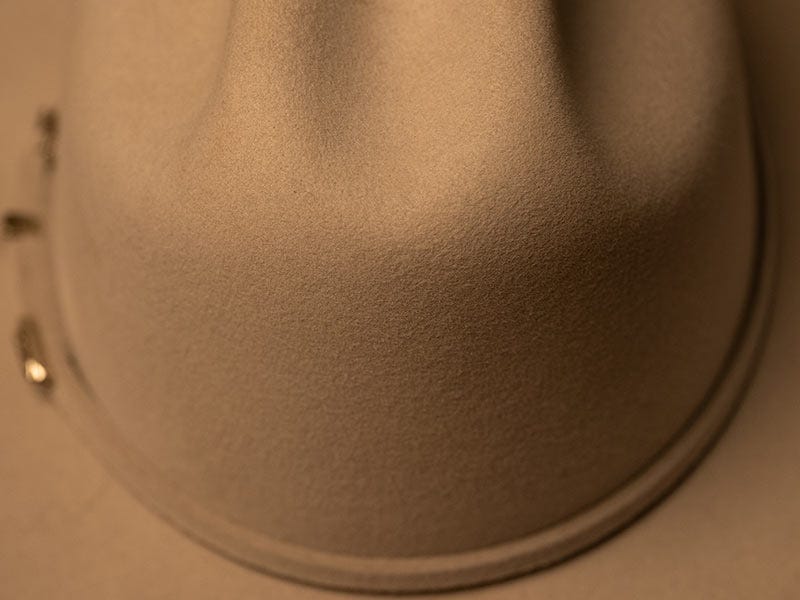 Close up of the crown of a felt Serratelli cowboy hat