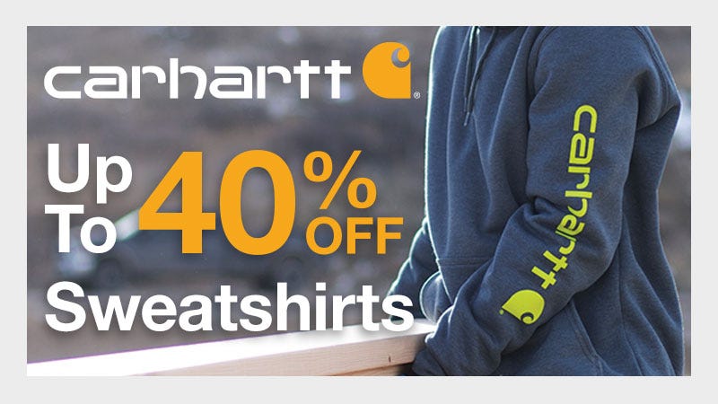 man carrying 3 2x4s in a carhartt sweatshirt; carhartt sale up to 40% off at north40; online and in store