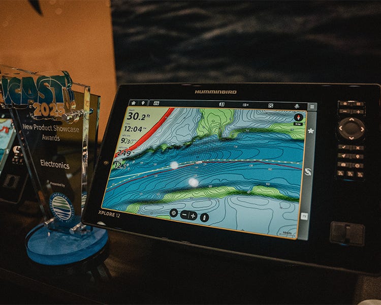 Humminbird XPLORE sonar unit with touchscreen interface and MEGA Live imaging demo playing on the display screen at ICAST 2025.