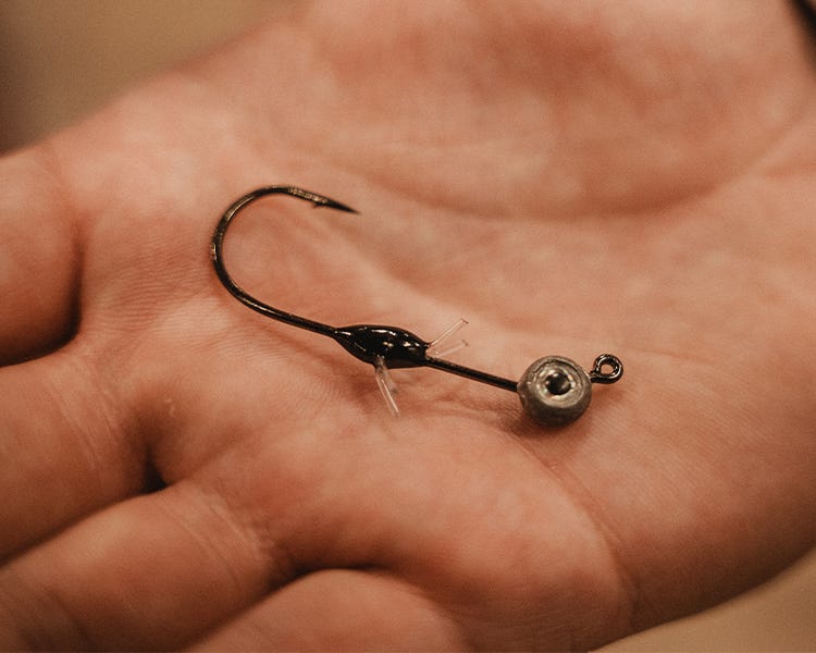 VMC Minnow Shaker Jig paired with Mooch Minnow in hand as size example at the VMC booth at the 2025 ICAST show.