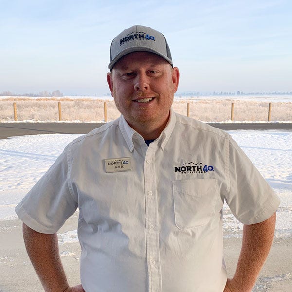 North 40 West Spokane, Washington store manager Jeff Blair standing outdoors while wearing a North 40 shirt