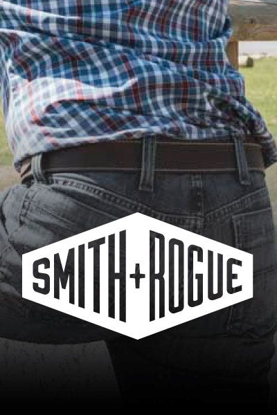 A close-up of the Smith and Rogue logo on a man's jeans, highlighting the brand's design and craftsmanship.