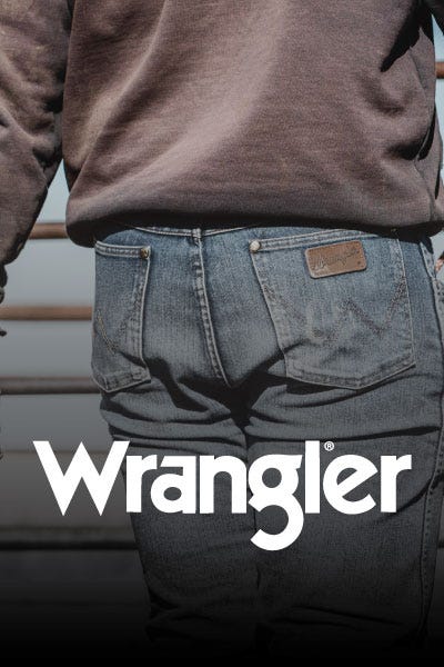 Close-up of men's Wrangler jeans, highlighting the fabric texture and iconic logo on the back pocket.