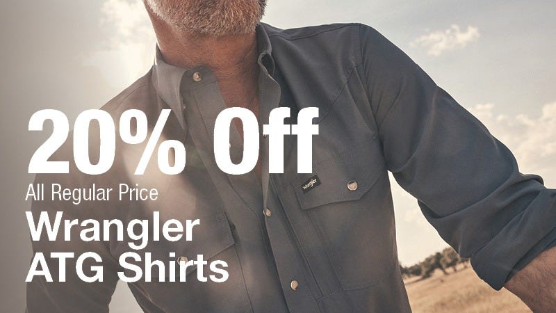 A close-up of a man wearing a blue Wrangler ATG shirt outdoors, with large white text overlay that reads "20% Off All Regular Price Wrangler ATG Shirts."