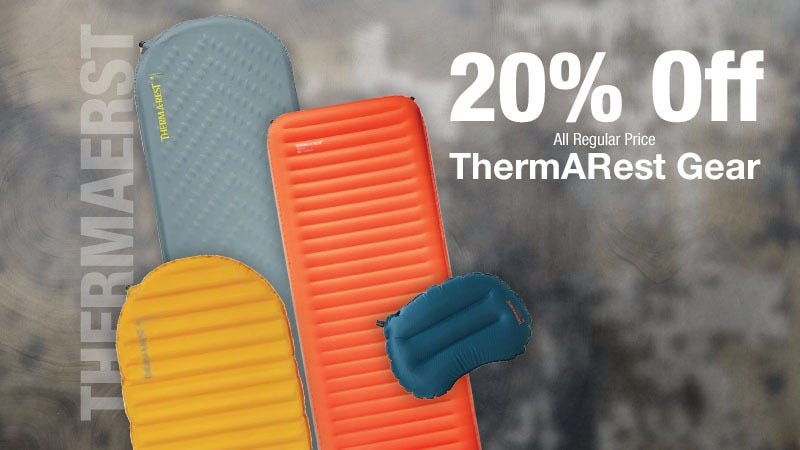 Three colorful sleeping pads and a blue pillow are displayed with the text "20% Off All Regular Price ThermARest Gear" on a blurred grey background.